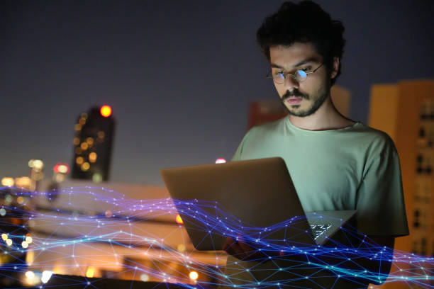 istock Man Working on Laptop with Digital Network Overlay 2166729227