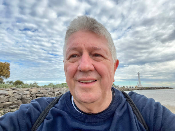 istock Senior Caucasian man selfie outdoors at beach 2166730927
