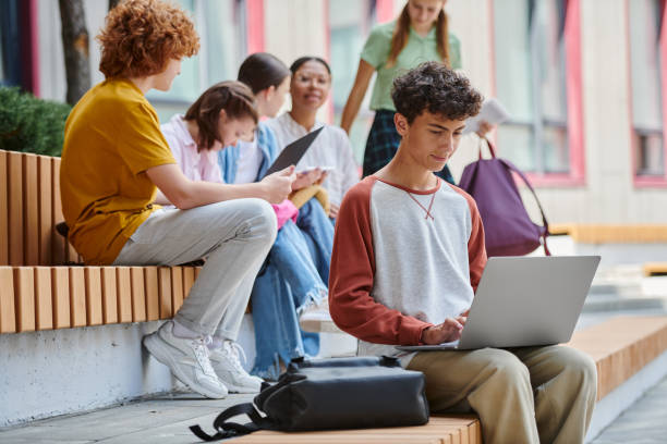 istock Teenage student engaged in learning outdoors during school hours 2166731910