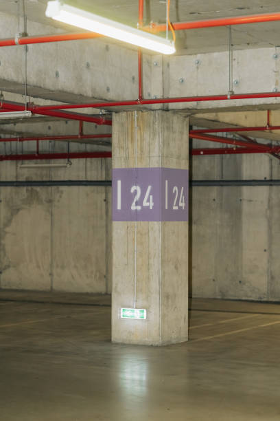 Parking lot with overhead dim light, underground parking garage