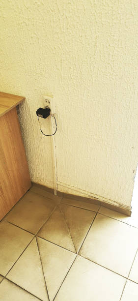 istock Concept shot of an old charger plugged in the socket. Technology 2166733456