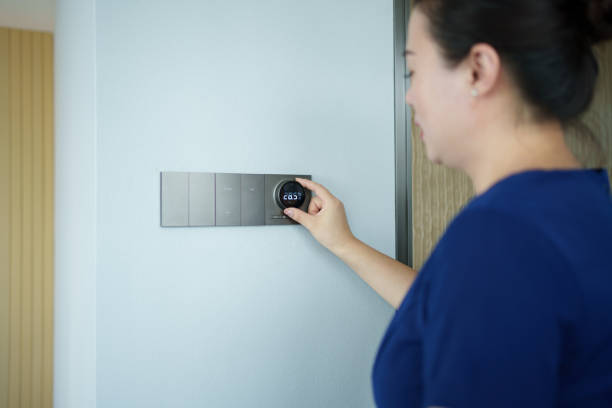 istock Asian woman using smart home 2166735984