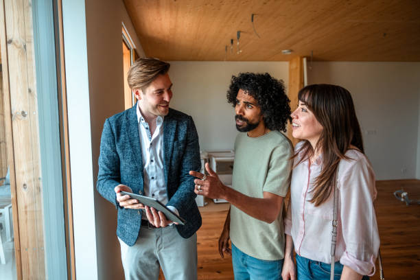 istock Diverse Trio Discussing 3D Renovation Plans on Tablet 2166737924