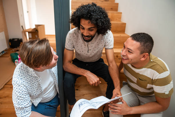 istock Multiracial Team Discussing Home Renovation Plans 2166737956