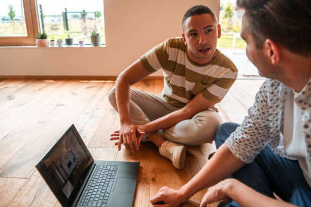 istock Two Professionals Reviewing 3D Home Renovation Plans 2166737978
