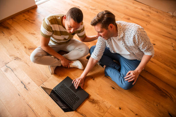 istock Professionals Reviewing 3D Renovation Blueprints 2166737980