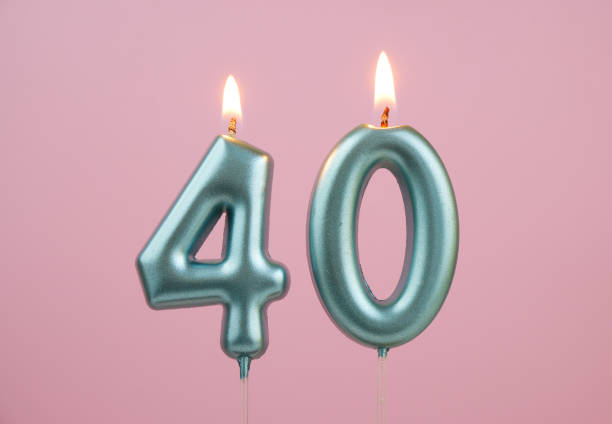 istock Blue birthday candles on pink background, number 40 2166741105