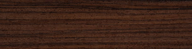 istock Rosewood veneer surface with rich, dark streaks and elegant wood patterns 2166743574
