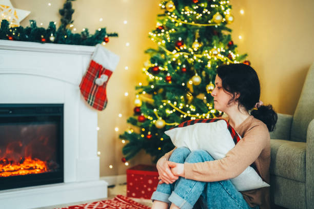 istock Depressed woman at home during Christmas 2166743805
