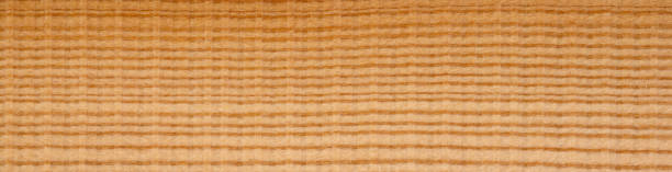 istock Larch wood veneer with intriguing horizontal saw cut, perfect for rustic interior projects 2166744134