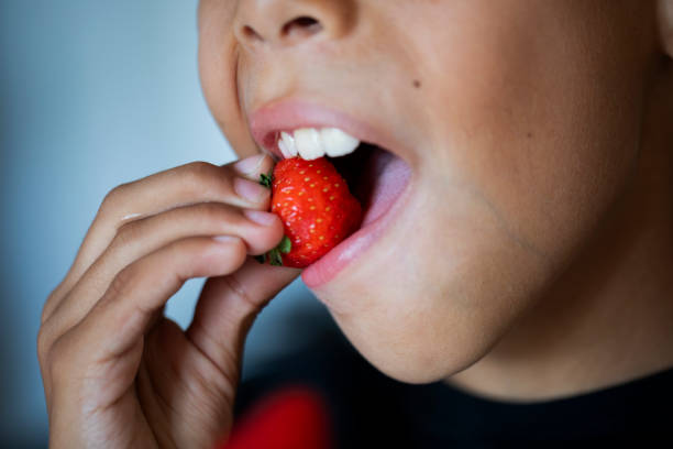 istock Child eating strawberries 2166744701
