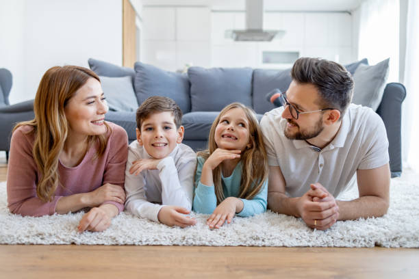 istock Happy family laying on floor 2166748378