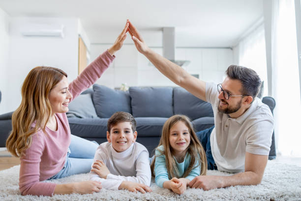 istock Family enjoying quality time forming a house shape 2166748379