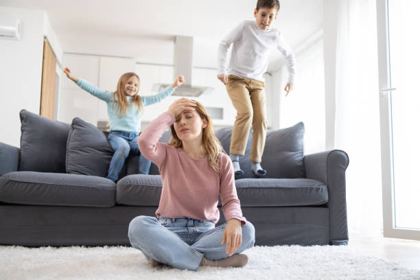 istock Mom with headache and lively kids 2166748393