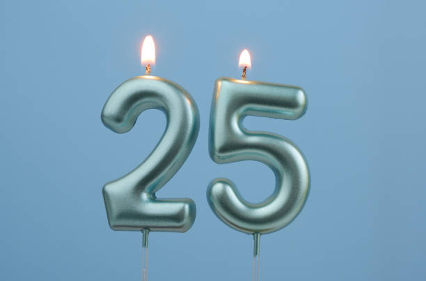 istock Blue birthday candles on blue background, number 25 2166748934