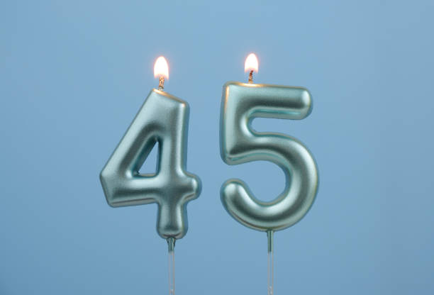 istock Blue birthday candles on blue background, number 45 2166748995