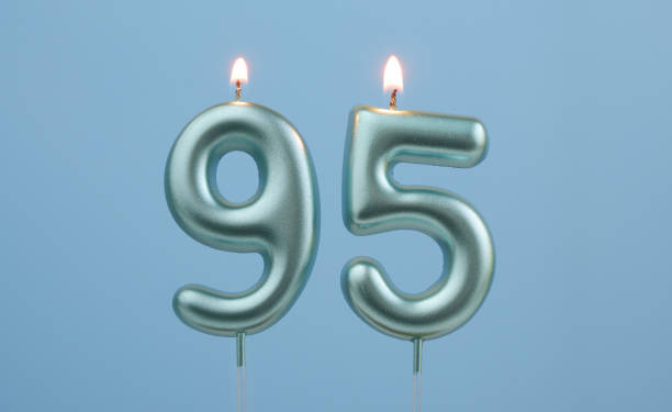 istock Blue birthday candles on blue background, number 95 2166749048
