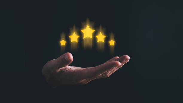 istock User give five-star rating to service experience, Customer review satisfaction feedback survey concept. Customer evaluation feedback. Men in suit Giving Positive Review Satisfaction. 2166750373