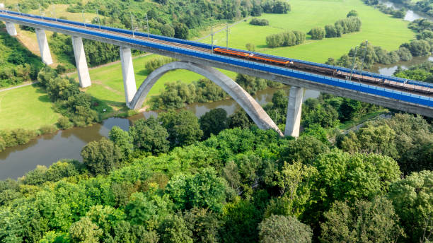 istock Railway bridge over river - aerial view 2166750928