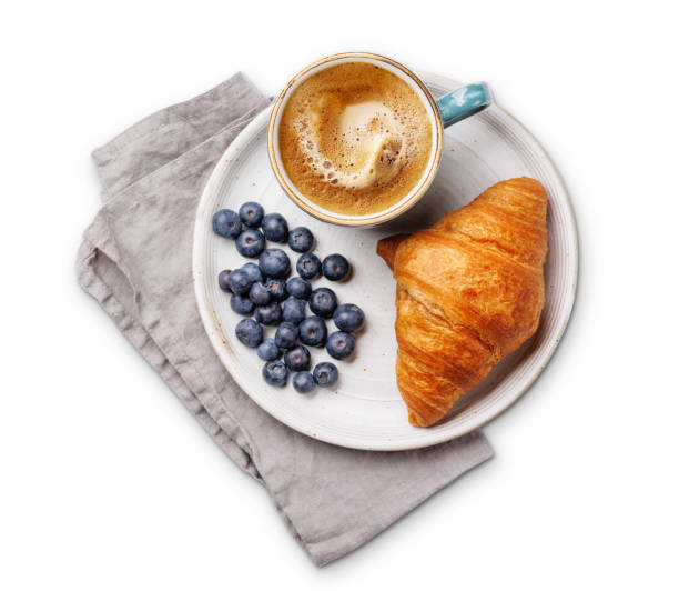 Cappuccino coffee and fresh croissant