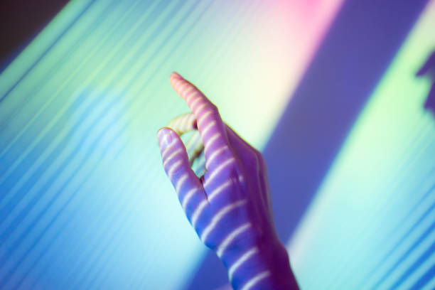istock A hand in soft colourful lighting 2166753259