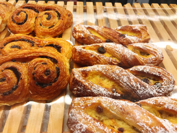 istock Bun with sesame seeds on display in a bakery shop. 2166756702