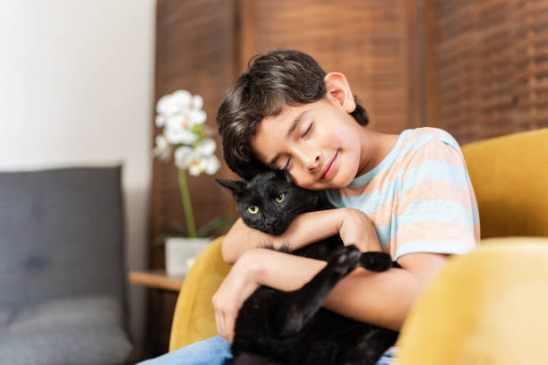istock Child boy with cat at home 2166759510