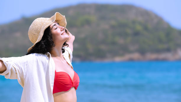 istock Pretty young girl on the seashore 2166761938