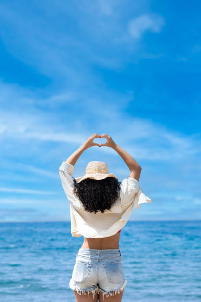 istock Pretty young girl on the seashore 2166761958