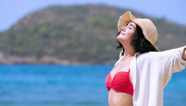 istock Pretty young girl on the seashore 2166762023