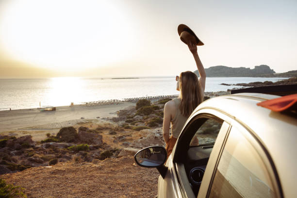 istock Summertime road trip. Young woman enjoying view 2166771323
