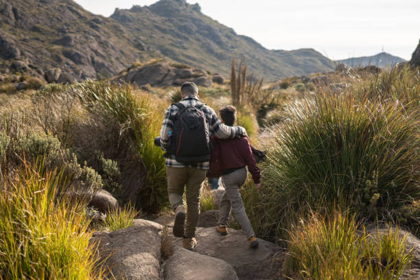 istock Father and son hiking in nature 2166771370