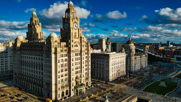 istock Dramatic skyline with historic buildings under a cloudy blue sky in Liverpool, UK. 2166772041
