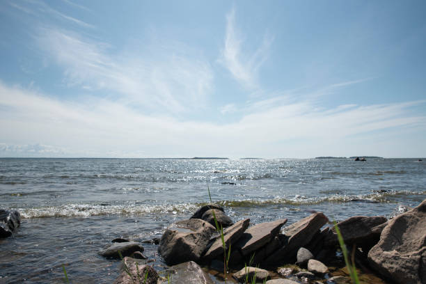 A rock formation on the shore of the sea on a beautiful Finnish summer day