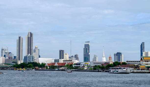 istock Bangkok Riverside Skyline Modern Skyscrapers and Historic Temples by Chao Phraya River 2166777520