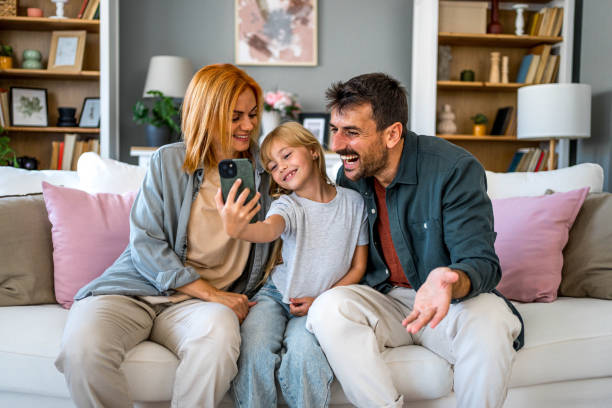 istock Young family taking selfies together 2166778500