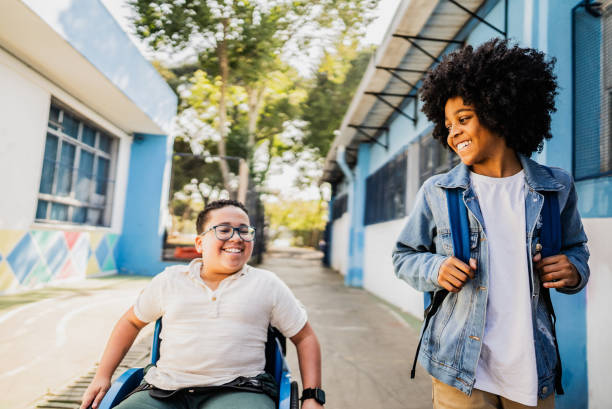 istock Students friends walking and talking on schoolyard 2166780474