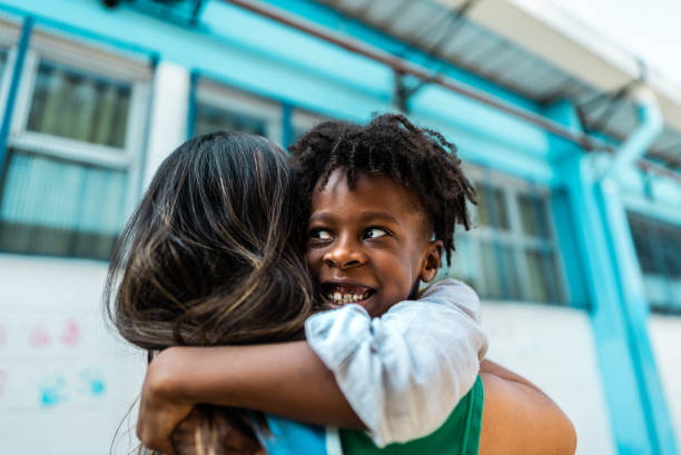 istock Student embracing teacher on schoolyard 2166780875