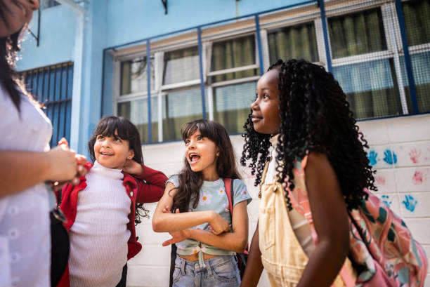 istock Students talking with teacher on schoolyard 2166780927