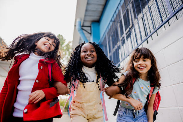 istock Friends walking on schoolyard 2166781121