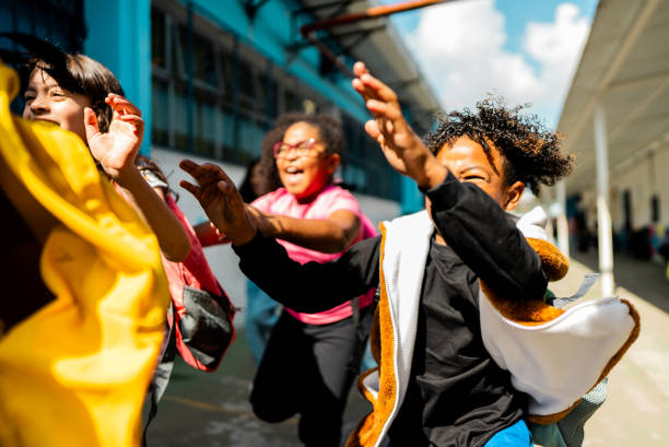 istock Student running with friends on schoolyard 2166781164