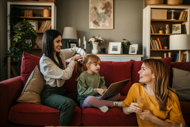 istock Mom Helping Daughter with Her Hair 2166781476