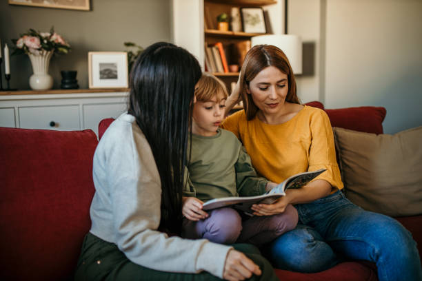 istock Family reading a book together 2166782258