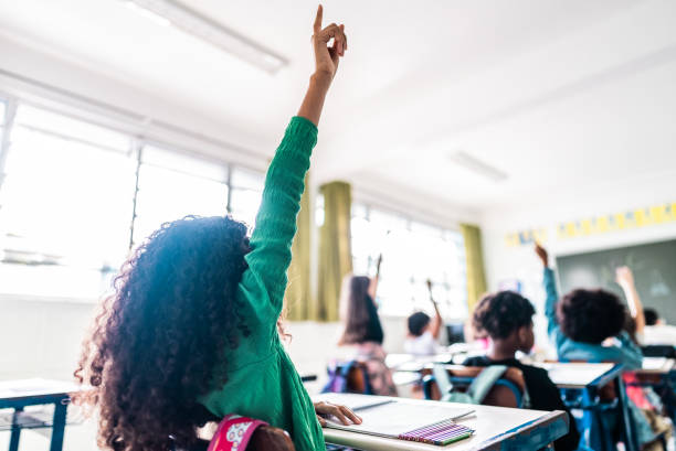 istock Rear view of a student asking on classroom at school 2166782357