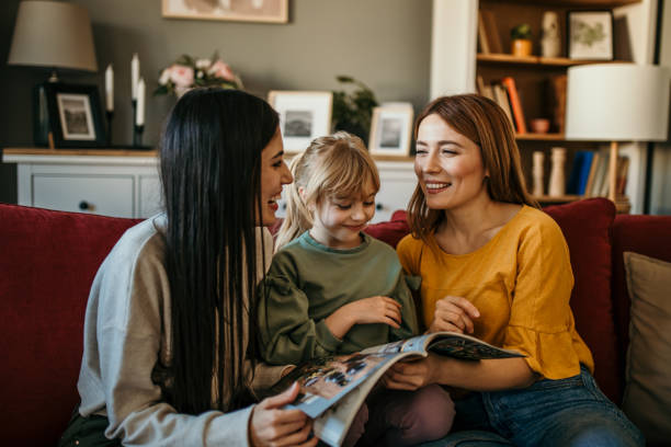 istock Family reading a book together 2166782375