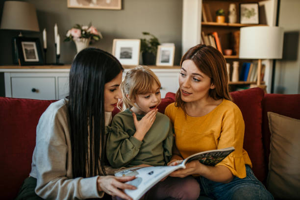 istock Family reading a book together 2166782442