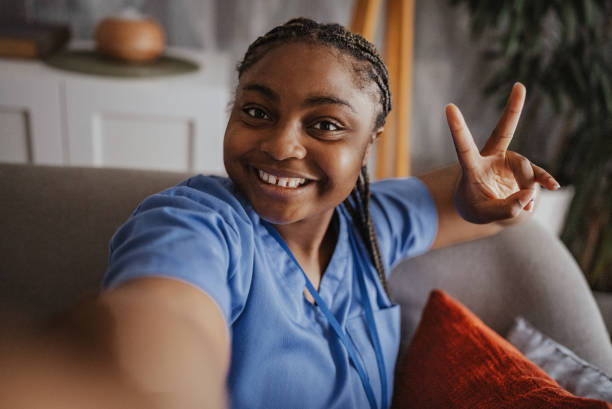 istock Smiling nurse taking a selfie showing peace sign. 2166782544