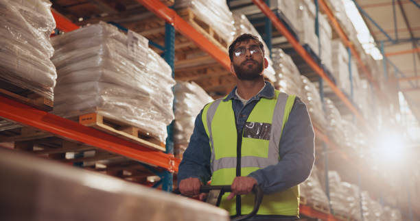 istock Box, packaging and man with trolley in warehouse for supply chain, logistics and inventory distribution. Dropshipping, picker and supplier with stock by shelf for order loading, shipping and delivery 2166784781