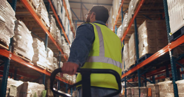 istock Box, storage and man with trolley in warehouse for supply chain, logistics and inventory distribution. Dropshipping, supplier and picker with stock by shelf for order loading, shipping and delivery 2166784783