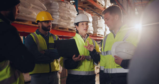 istock Distribution, tablet and group in warehouse, teamwork and inventory with planning, logistics and supply chain. People, employees and supervisor with tech, cooperation and conversation with advice 2166784813